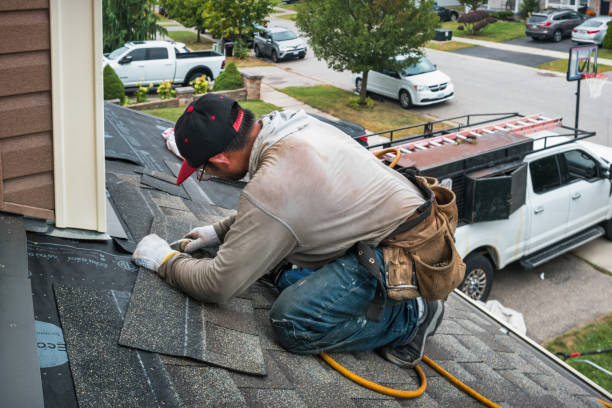 Professional Flat Roof Repair technician working in Portland, MI
